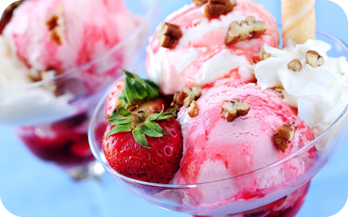Colorful pastel scoops of ice cream in waffle cones